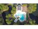 Aerial view of a beautiful community pool and playground with a large pond nearby at 4969 Franconia Dr, Summerville, SC 29485