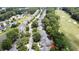 Expansive aerial view of a neighborhood with a golf course, showcasing the home's proximity to green spaces at 4969 Franconia Dr, Summerville, SC 29485