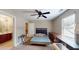 Bedroom with a ceiling fan and adjacent bathroom, offering convenience and privacy for residents at 4969 Franconia Dr, Summerville, SC 29485
