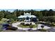 Stunning clubhouse with a circular driveway and water feature set against a backdrop of lush greenery at 4969 Franconia Dr, Summerville, SC 29485