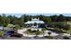 Attractive clubhouse entrance with a circular drive and scenic water feature at 4969 Franconia Dr, Summerville, SC 29485