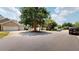 Charming home featuring a well-manicured front yard, attached garage, and inviting front porch at 4969 Franconia Dr, Summerville, SC 29485