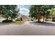 Charming home featuring a well-manicured front yard, attached garage, and inviting front porch at 4969 Franconia Dr, Summerville, SC 29485