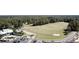 Scenic aerial view of a golf course with diverse green spaces and manicured sand traps at 4969 Franconia Dr, Summerville, SC 29485