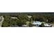 Picturesque aerial view showcasing the golf course winding through dense woods, offering a serene retreat at 4969 Franconia Dr, Summerville, SC 29485
