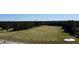Wide aerial shot of a well-maintained golf course and practice range at 4969 Franconia Dr, Summerville, SC 29485