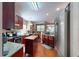 A modern kitchen with stainless steel appliances, wood cabinets, and a convenient movable butcher block island at 4969 Franconia Dr, Summerville, SC 29485