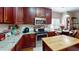 A well-appointed kitchen featuring stainless steel appliances, granite counters, and ample cabinet space at 4969 Franconia Dr, Summerville, SC 29485