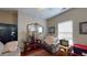 Cozy living room with a ceiling fan, comfortable seating, and vintage decorations at 4969 Franconia Dr, Summerville, SC 29485