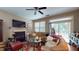 Inviting living room with a fireplace, ceiling fan and sliding door to an outdoor space at 4969 Franconia Dr, Summerville, SC 29485