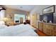 Main bedroom showcasing a well-lit interior with a window view, dresser, and bathroom access at 4969 Franconia Dr, Summerville, SC 29485