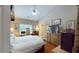 Bright main bedroom with a spacious layout, wood floors, and ensuite bathroom at 4969 Franconia Dr, Summerville, SC 29485
