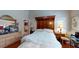 Spacious main bedroom featuring hardwood floors and a large bed with a decorative wooden headboard at 4969 Franconia Dr, Summerville, SC 29485