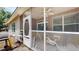 Angle view of the screened-in porch with patio furniture and a view of the backyard at 4969 Franconia Dr, Summerville, SC 29485