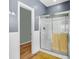 Bathroom with gray walls, white trim, shower with sliding glass doors and hooks on the wall at 519 Tarleton Dr, Summerville, SC 29483