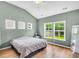 Bright bedroom features natural light, high ceilings, and hardwood floors at 519 Tarleton Dr, Summerville, SC 29483