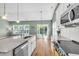 Modern kitchen with white cabinets, stainless steel appliances, granite countertops, and island at 519 Tarleton Dr, Summerville, SC 29483