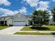 Charming single-story home featuring a well-manicured lawn, attached two-car garage, and inviting front entryway at 699 Battery Edge Dr, Summerville, SC 29486