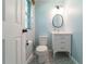 Powder room featuring stylish vanity with tile flooring and a bright window at 7 Plainfield Dr, Charleston, SC 29407