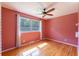 Bedroom featuring hardwood floors, a ceiling fan, and a sun-filled window at 7 Plainfield Dr, Charleston, SC 29407