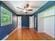 Spacious bedroom with hardwood floors, closet space, and a connected full bathroom at 7 Plainfield Dr, Charleston, SC 29407