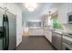 Modern kitchen featuring stainless steel appliances, white cabinets, and an open layout for entertaining at 7 Plainfield Dr, Charleston, SC 29407