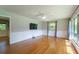 Bright living room featuring hardwood floors, large windows, and a ceiling fan providing comfort at 7 Plainfield Dr, Charleston, SC 29407