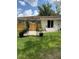 Green backyard featuring landscaping, patio, privacy fence, and outdoor greenery at 702 N N Palmetto St, Summerville, SC 29483