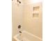 Tiled shower and tub combination in a well-lit and bright bathroom at 702 N N Palmetto St, Summerville, SC 29483