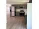 An open kitchen with new stainless steel appliances and light gray cabinetry at 702 N N Palmetto St, Summerville, SC 29483