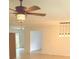 Spacious and bright living room featuring updated floors and a modern ceiling fan at 702 N N Palmetto St, Summerville, SC 29483