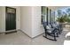 Inviting front porch with rocking chairs offers a relaxing outdoor space at 727 Breakers Reef Ln, Huger, SC 29450