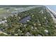 An aerial view shows a charming home location marked with a yellow pin, positioned near a scenic lake and coastline at 817 Cheehaw St, Edisto Island, SC 29438