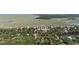 This photo shows an aerial view of the home with a yellow pin, positioned within a picturesque neighborhood, marsh and pond at 817 Cheehaw St, Edisto Island, SC 29438