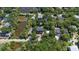 A scenic aerial view showcases the property, nestled among trees near a pond with a yellow pin marking the location at 817 Cheehaw St, Edisto Island, SC 29438
