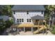 Elevated view of new home construction with a spacious porch and stairs at 817 Cheehaw St, Edisto Island, SC 29438