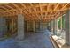 Open basement area with exposed beams and concrete flooring, ready for customization and ample storage at 817 Cheehaw St, Edisto Island, SC 29438