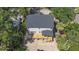 Aerial view of a new house with back deck and roof, surrounded by lush greenery at 817 Cheehaw St, Edisto Island, SC 29438