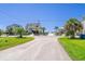Charming beachside home with palm trees, offering a relaxed coastal lifestyle and a view of the beach at 817 Cheehaw St, Edisto Island, SC 29438