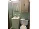 Bathroom featuring vintage green tiling, a sink vanity, a toilet, and built in cabinetry at 874 Evans Rd, Charleston, SC 29412