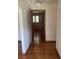 View through doorway showing bedroom with paneled walls and parquet wood flooring at 874 Evans Rd, Charleston, SC 29412