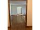 Hallway featuring hardwood floors and a view into another room with an arched entry at 874 Evans Rd, Charleston, SC 29412