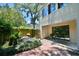 A fenced backyard with a red brick patio, a small garden, and outdoor seating area at 93 Ashley Hall Plantation Rd # 6, Charleston, SC 29407