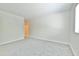 Large bedroom with plush carpeting, light-colored walls, and a window offering abundant natural light at 93 Ashley Hall Plantation Rd # 6, Charleston, SC 29407