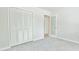 Bedroom featuring bi-fold closet doors and an open doorway leading to another room at 93 Ashley Hall Plantation Rd # 6, Charleston, SC 29407