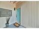 Charming entryway with a blue door, welcome mat, and decorative potted plant at 93 Ashley Hall Plantation Rd # 6, Charleston, SC 29407