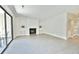 Living room showcasing a fireplace, tiled floors, and access to an outdoor patio at 93 Ashley Hall Plantation Rd # 6, Charleston, SC 29407