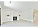 Bright living room featuring a fireplace, tiled floors, and a closet for storage at 93 Ashley Hall Plantation Rd # 6, Charleston, SC 29407
