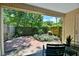 Outdoor patio framed with lush greenery and foliage in a tranquil backyard setting at 93 Ashley Hall Plantation Rd # 6, Charleston, SC 29407