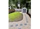 Well-maintained backyard featuring a shed, seating area, and manicured lawn at 10 Riker St, Charleston, SC 29403